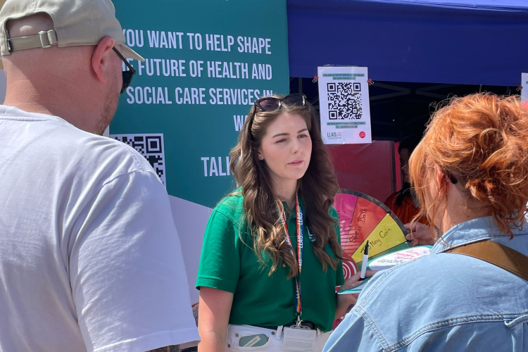 llais member of staff at an event 